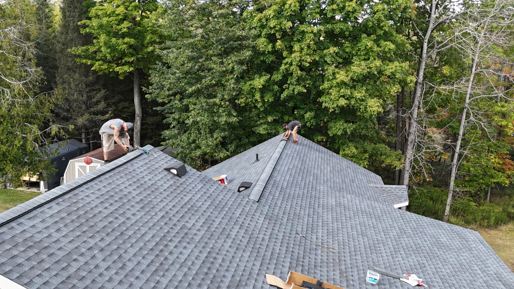 An image of LeDuc Construction roofing a house.